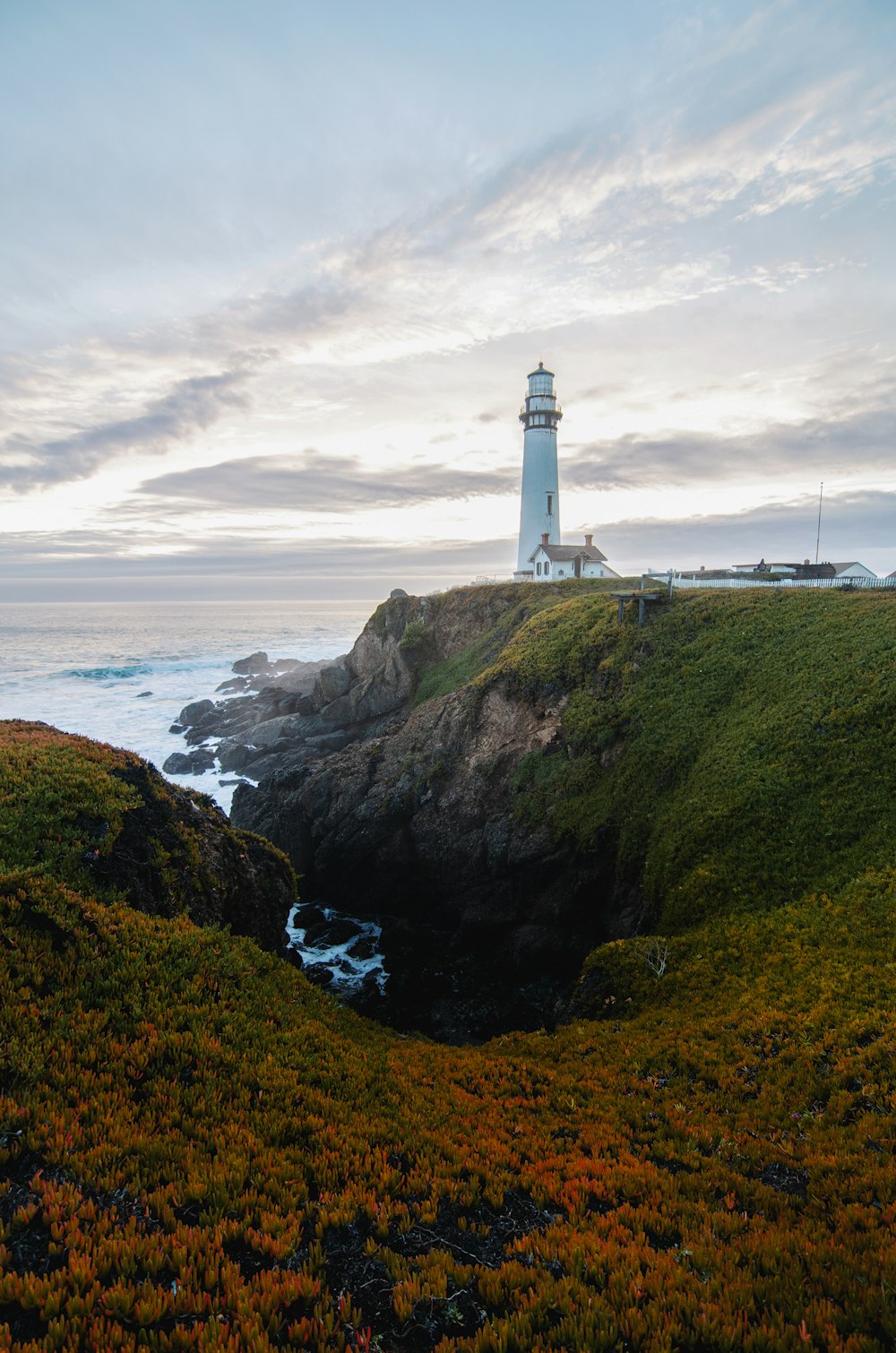 a lighthouse on a hill