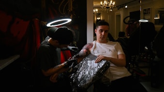 a man holding a woman in a white dress