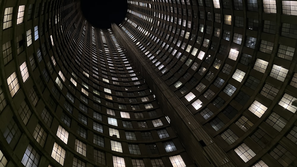 a large building with many windows with Ponte City Apartments in the background