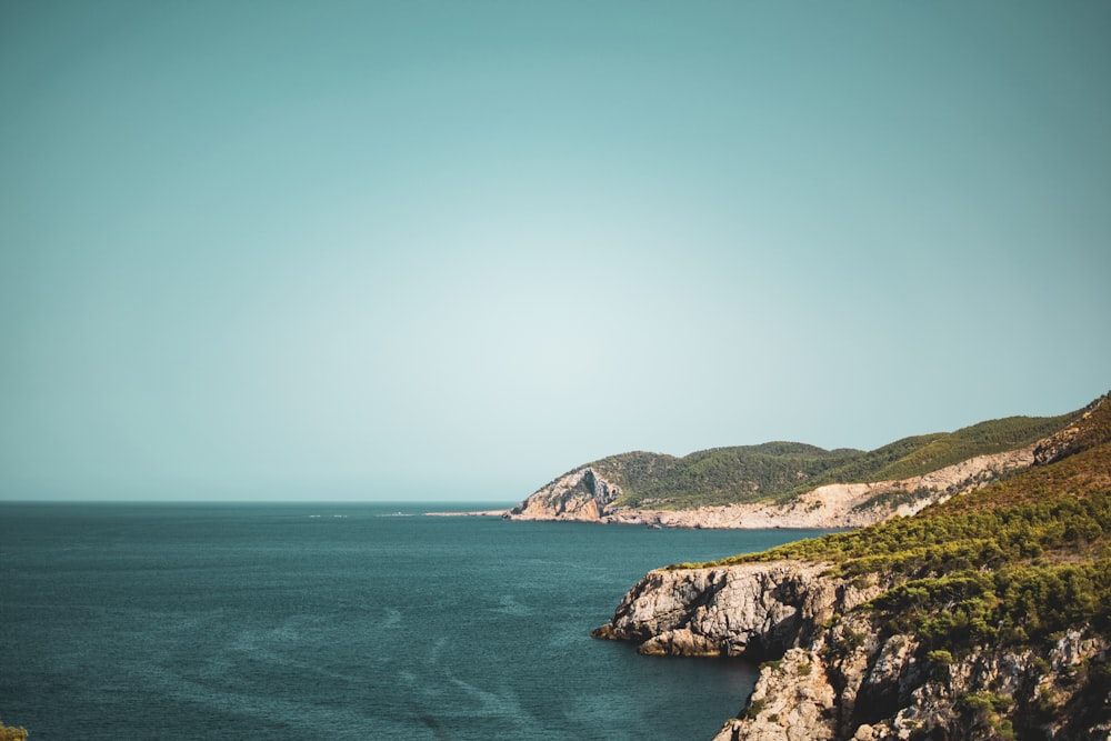 a body of water with hills on the side