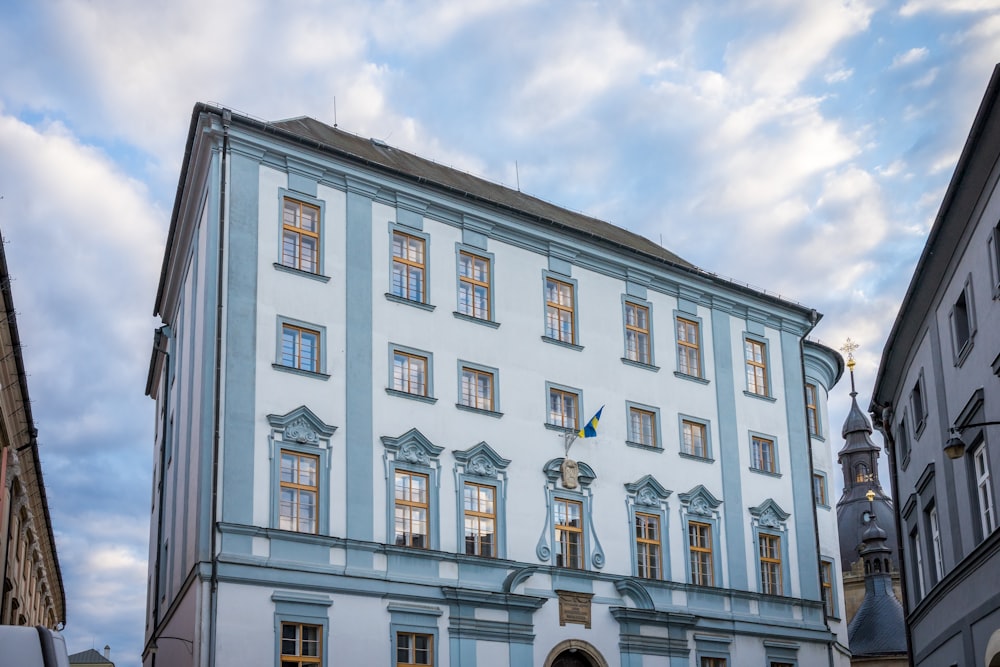 a blue building with many windows