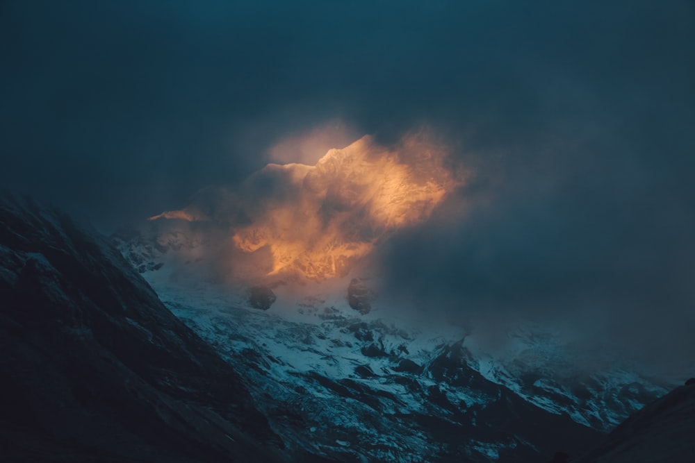 a mountain with a cloud of smoke