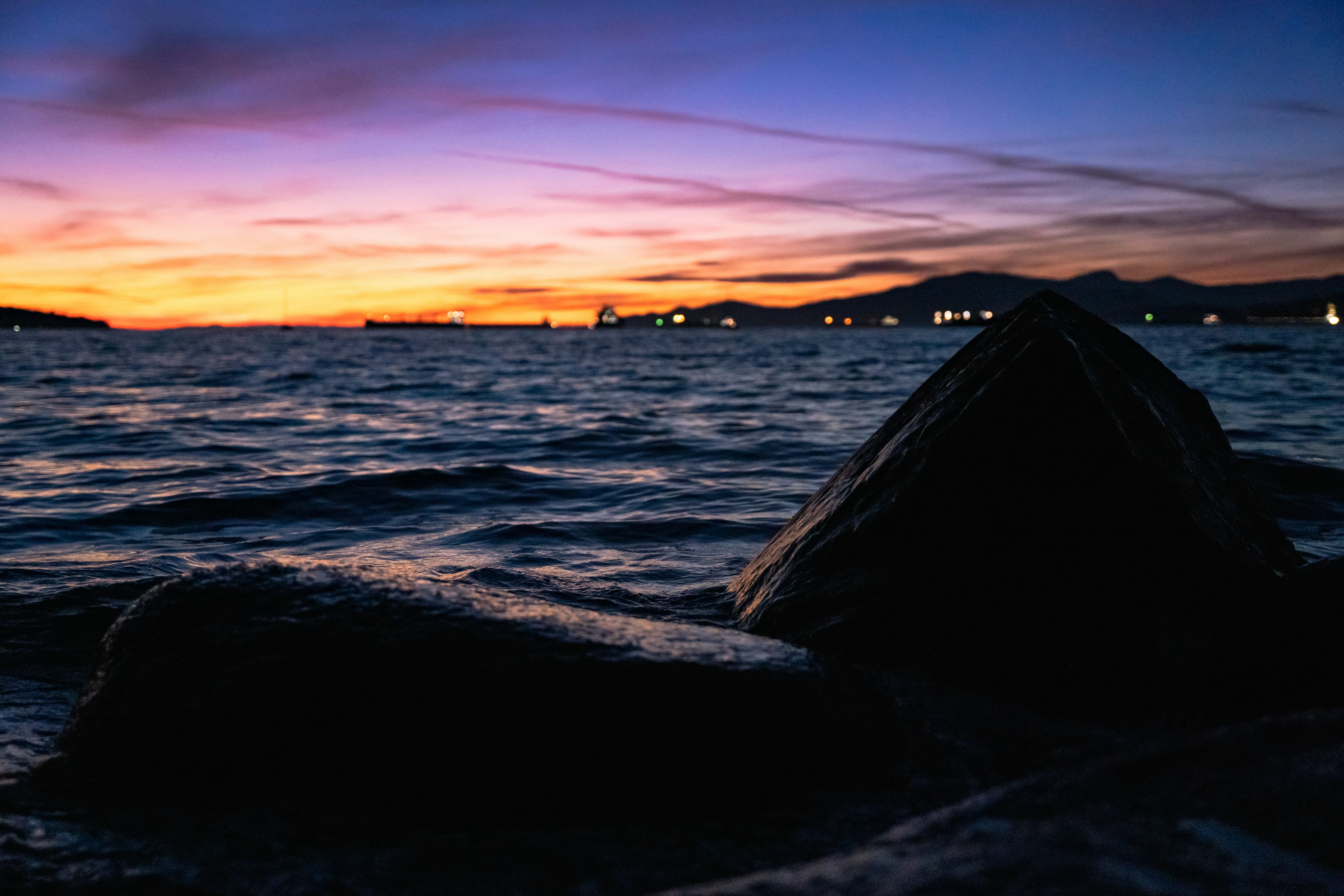 A rocky beach at sunset photo Free Canada Image on Unsplash