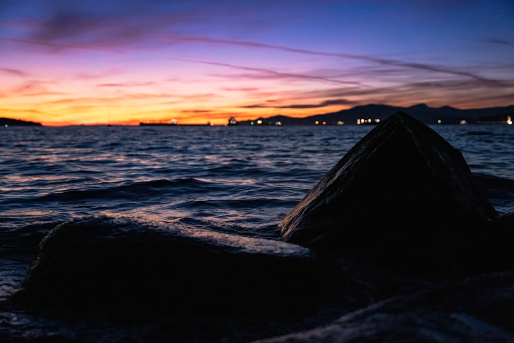 a rocky beach at sunset