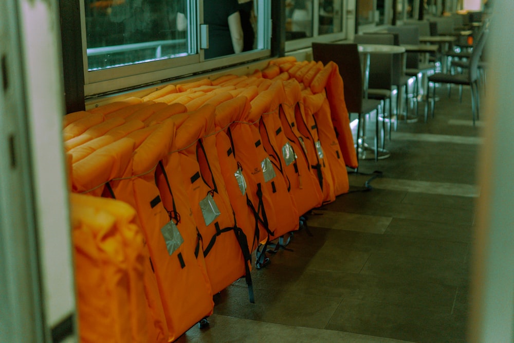 a row of orange chairs