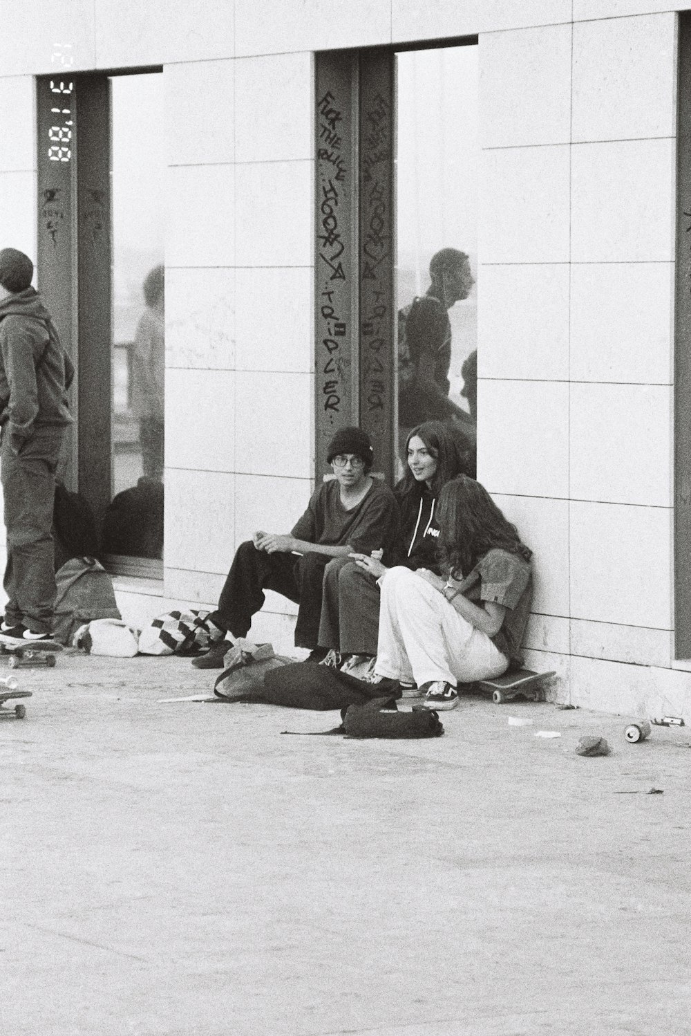 a couple of women sitting on the ground