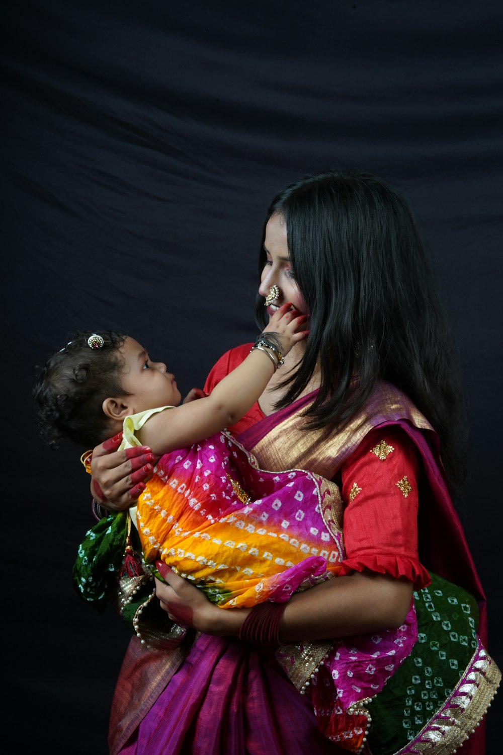 a woman kissing a child