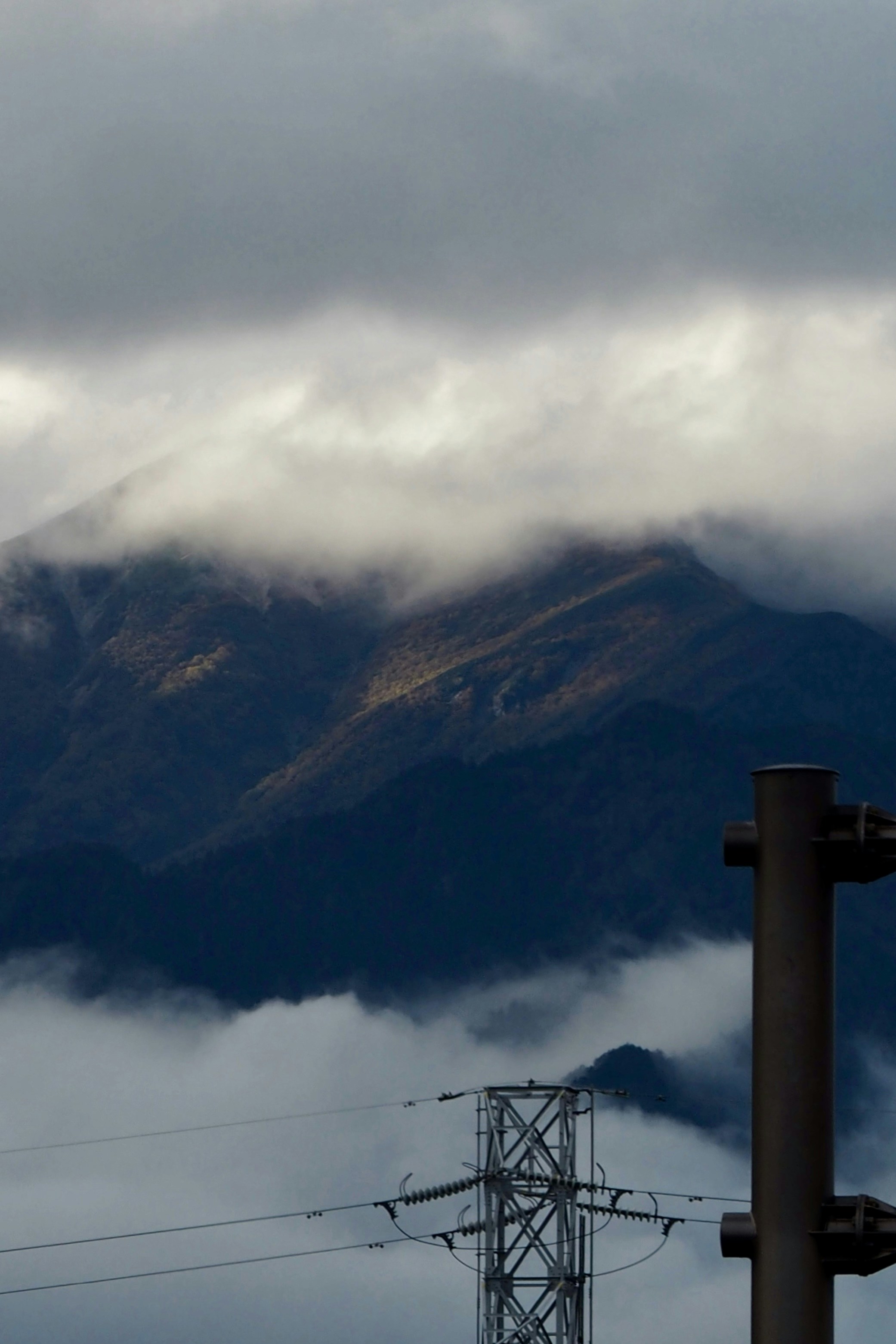 a view of a mountain range from a cable car