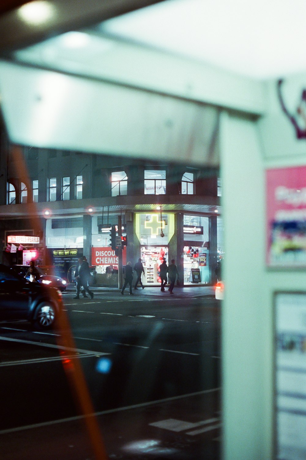 a street with people and cars