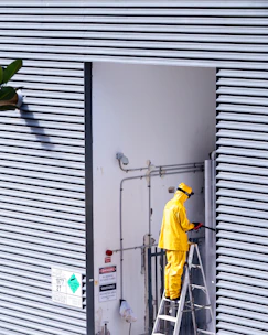 a person in a yellow jumpsuit