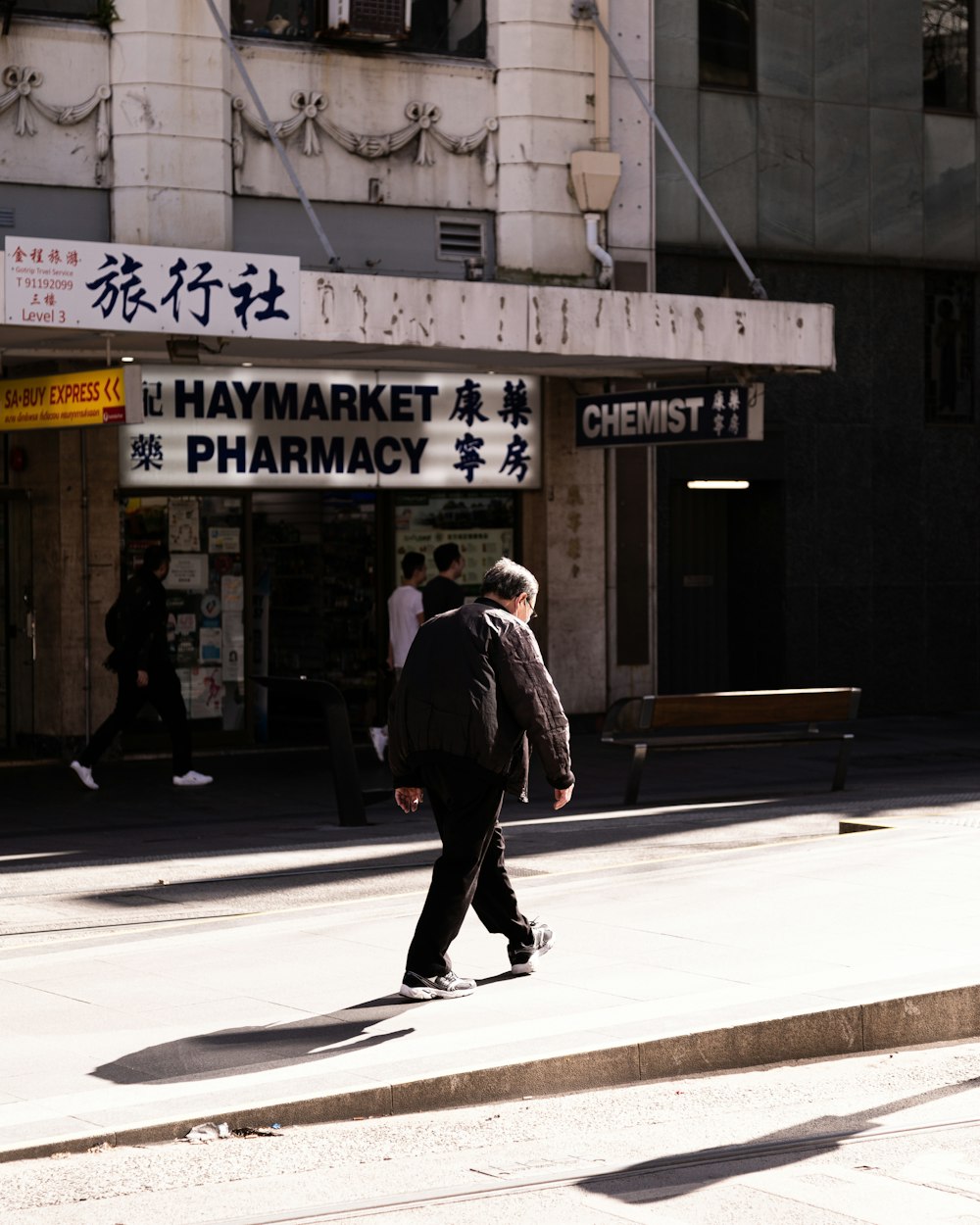 a man skateboards down a sidewalk