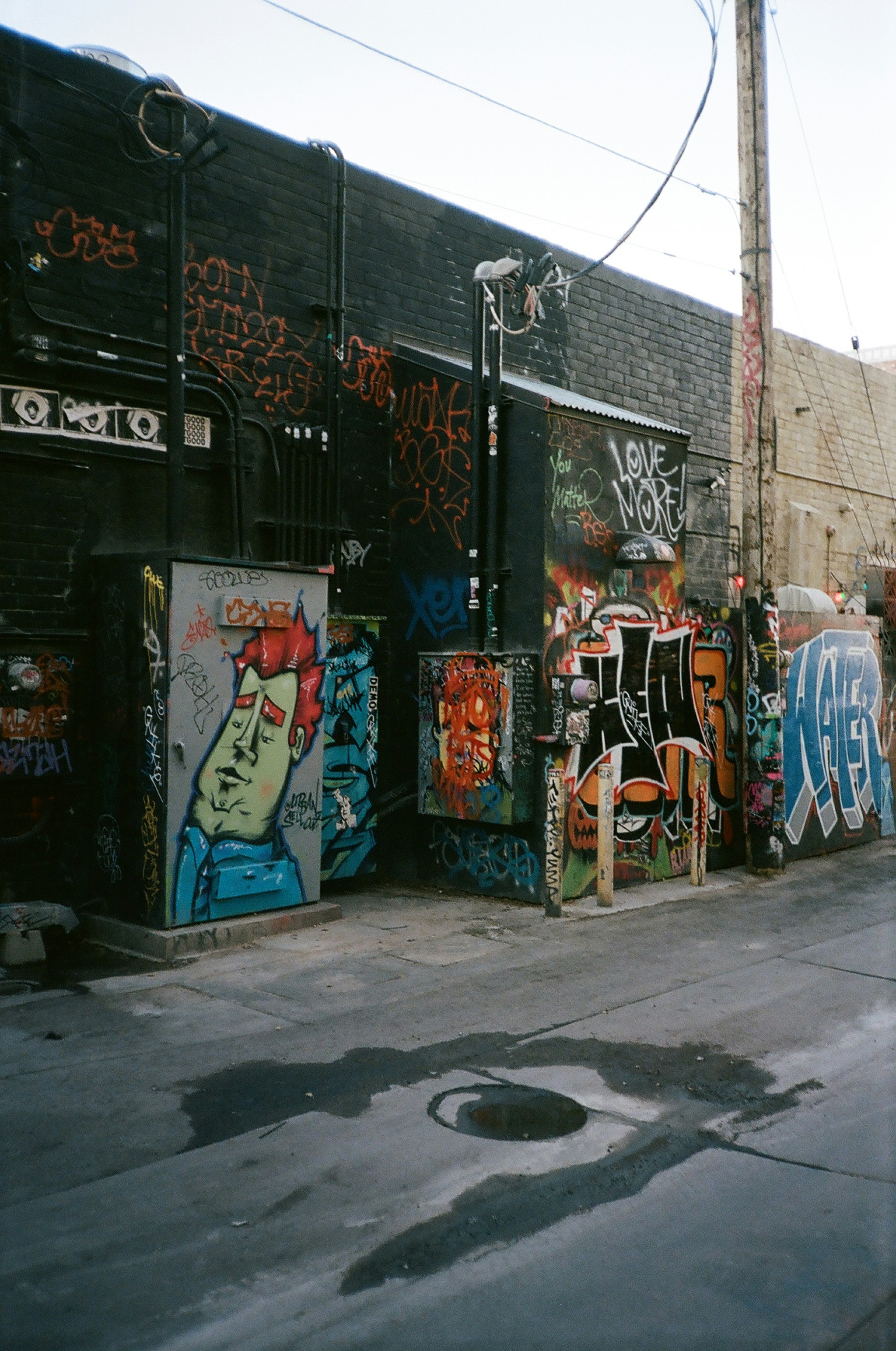 a wall covered in graffiti