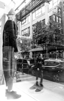 An outdoor scene showcasing fashionable apparel on a mannequin.