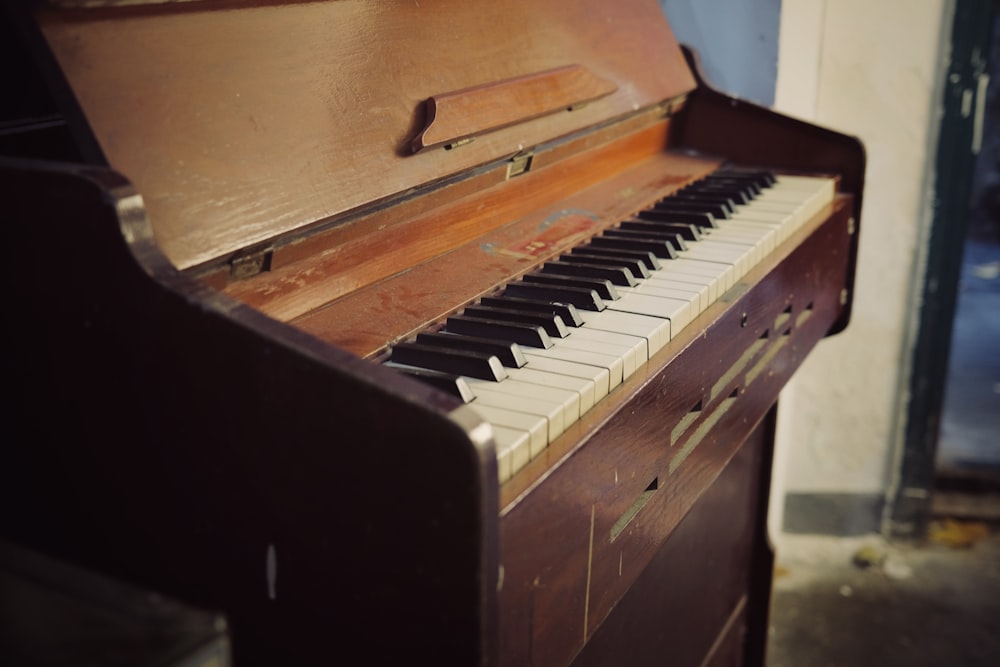 a wooden piano with a wooden box