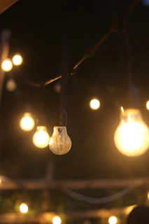 A collection of solar-powered LED lights glowing softly in a cozy office setting.