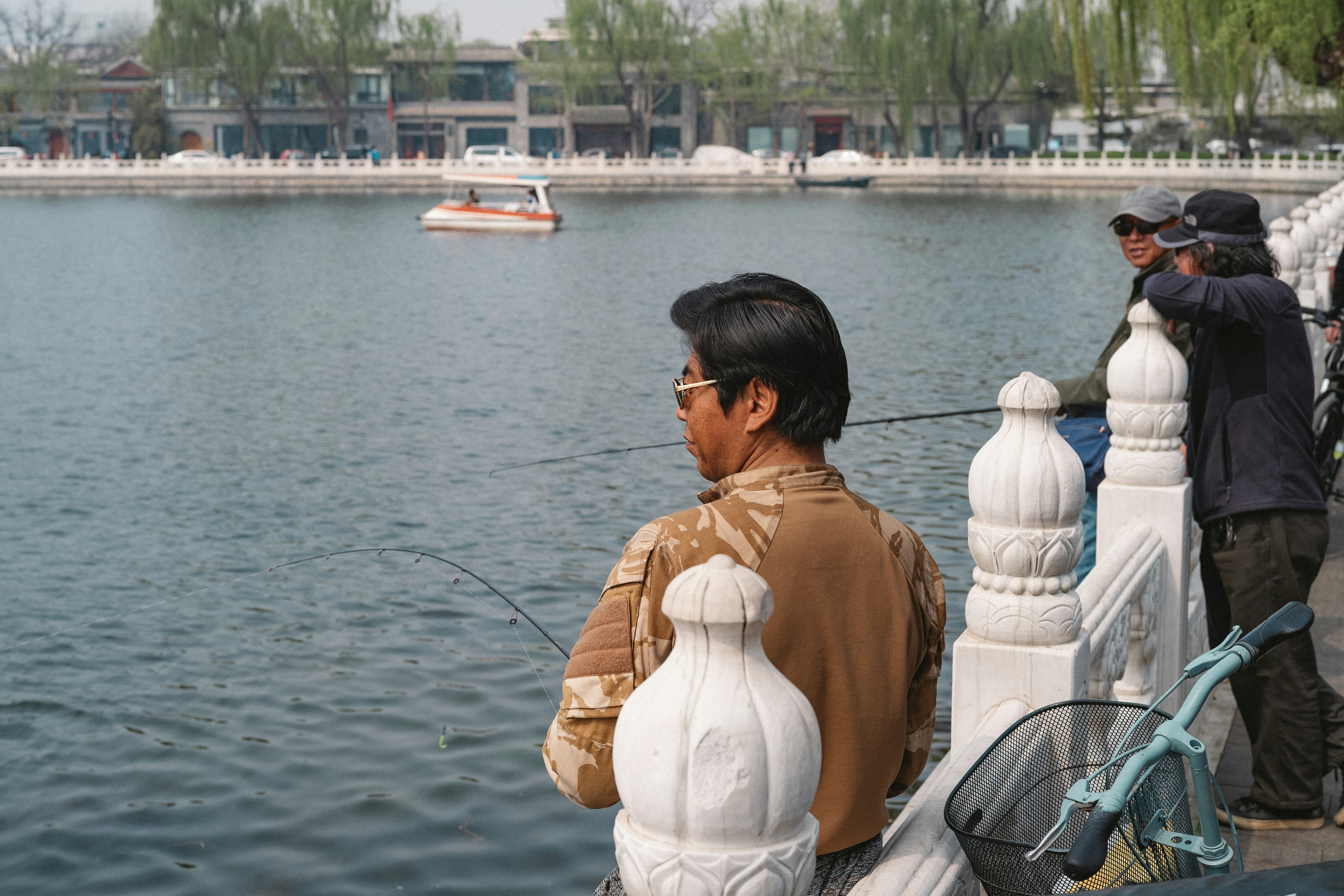 a person standing next to a body of water