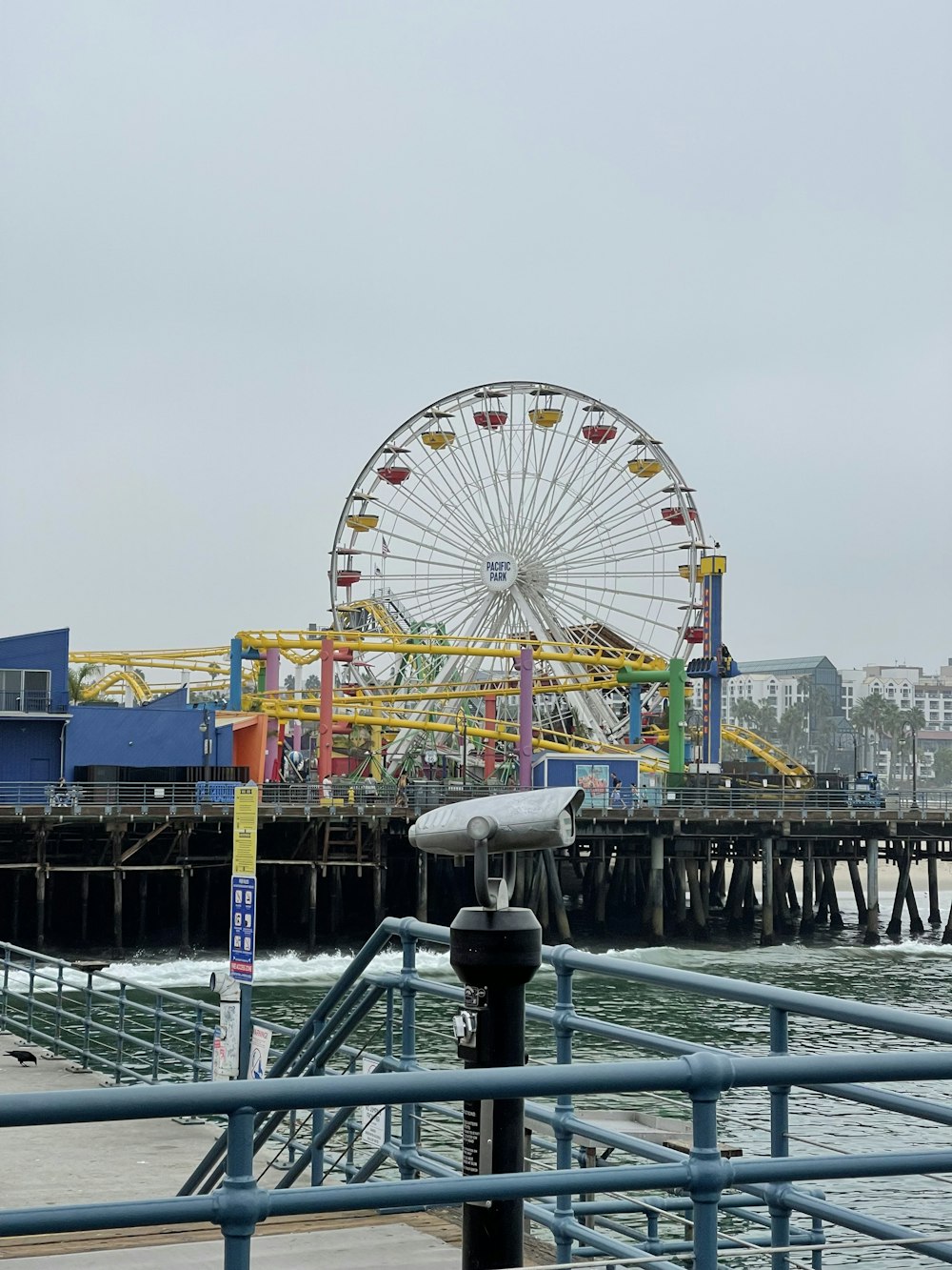 a ferris wheel by a body of water