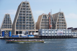 a boat in the water by a building