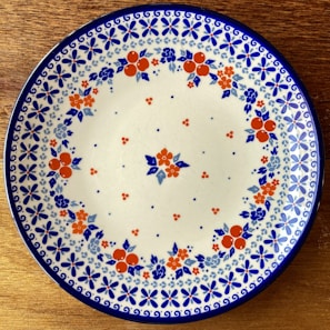 An elegant ceramic plate featuring a floral pattern.