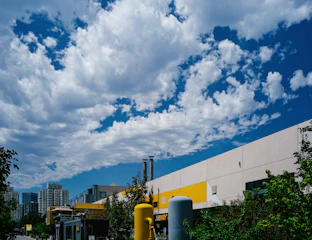 A vibrant cityscape showing residential and commercial buildings for sale.