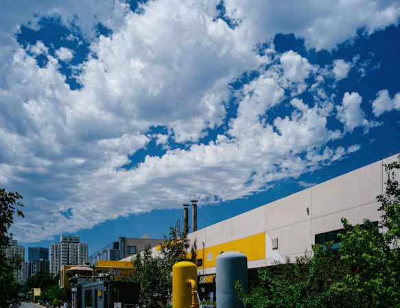 a large white building with a blue sky above it