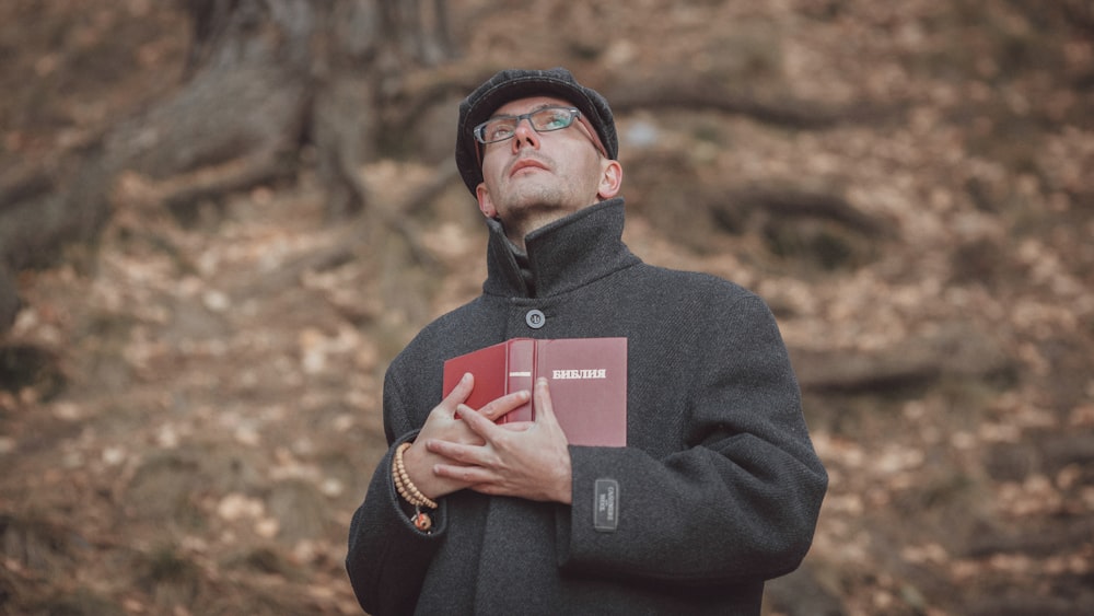 a man wearing glasses and a hat