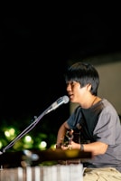 a man singing into a microphone