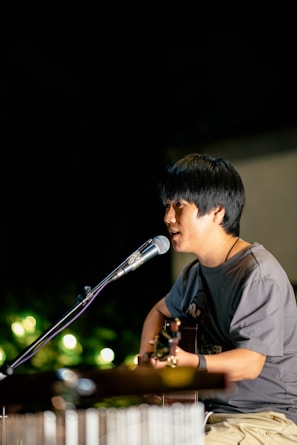 a man singing into a microphone