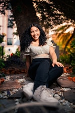 Dr. Pallavi Parikh warmly consulting with a patient in a serene, natural setting.