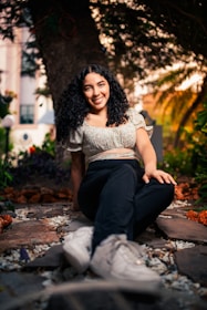 Dr. Pallavi Parikh warmly consulting with a patient in a serene, natural setting.