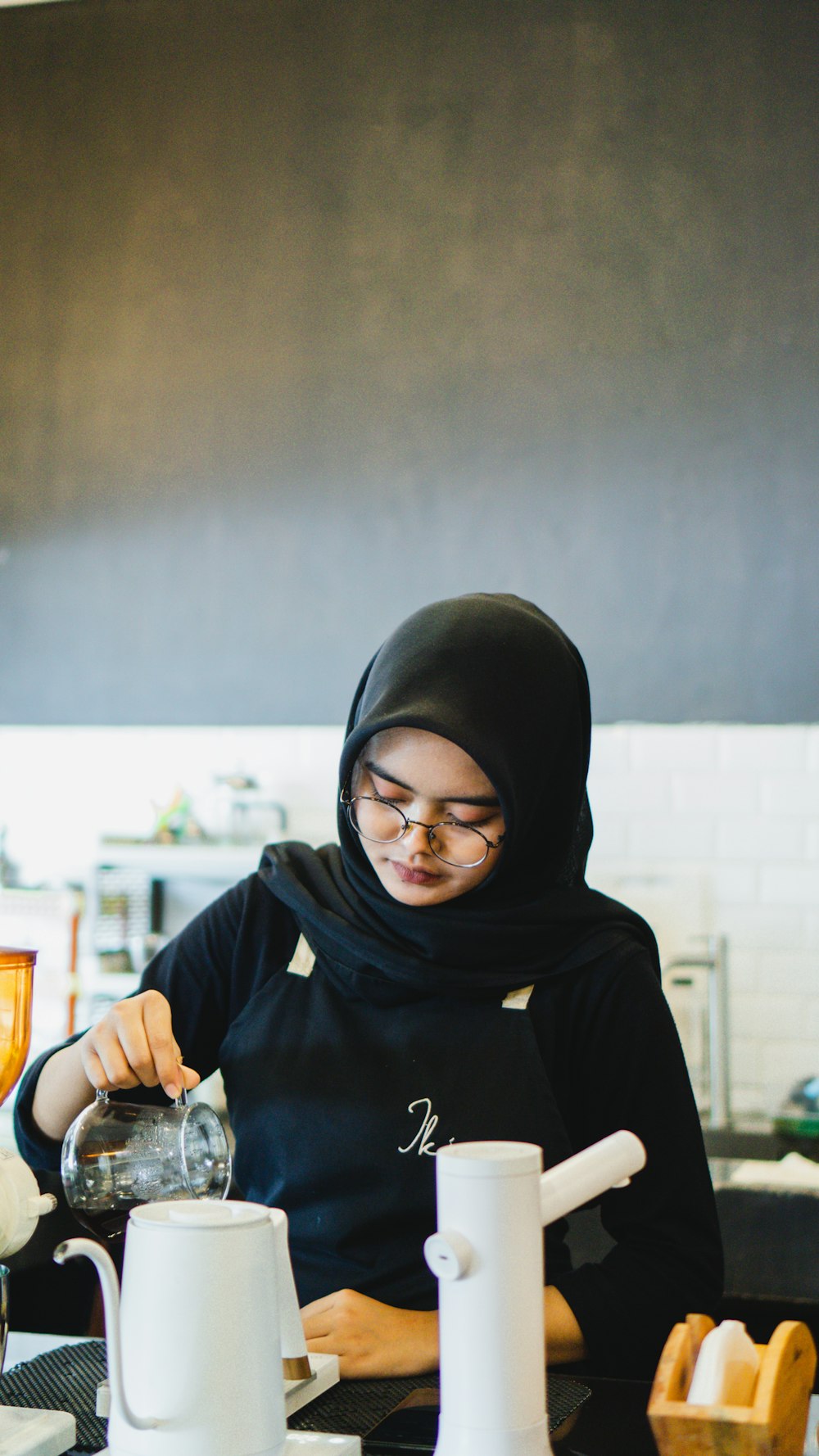 a woman wearing a black head covering