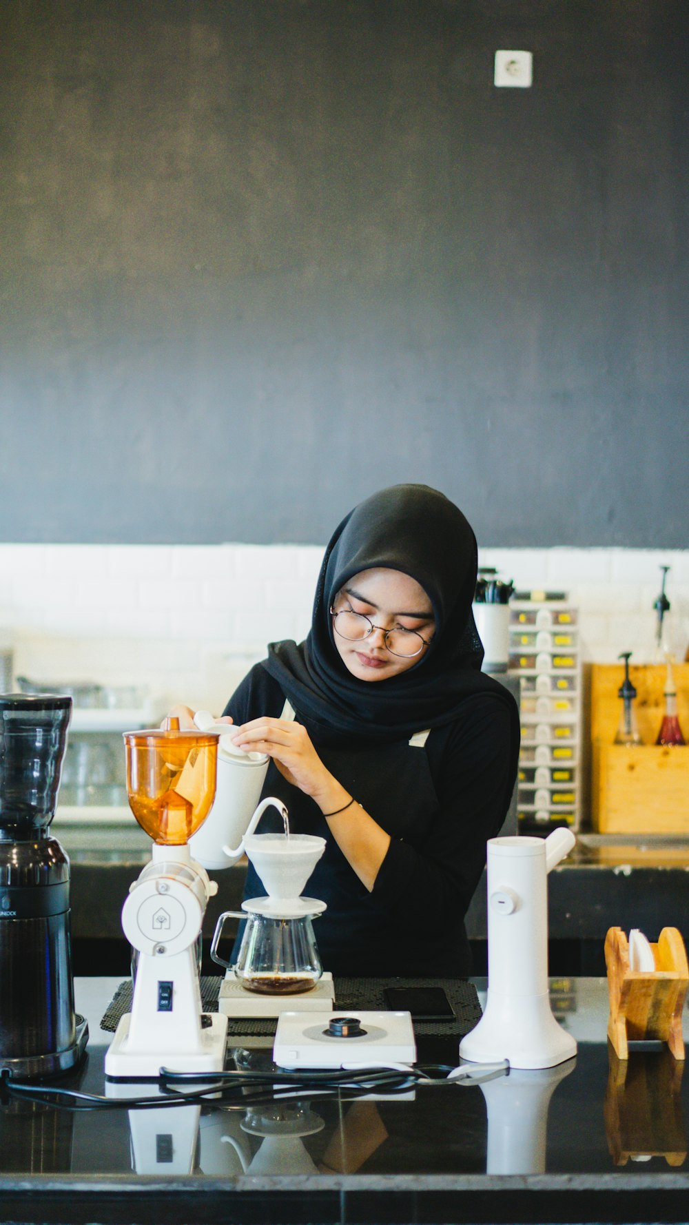 a person wearing a black head covering