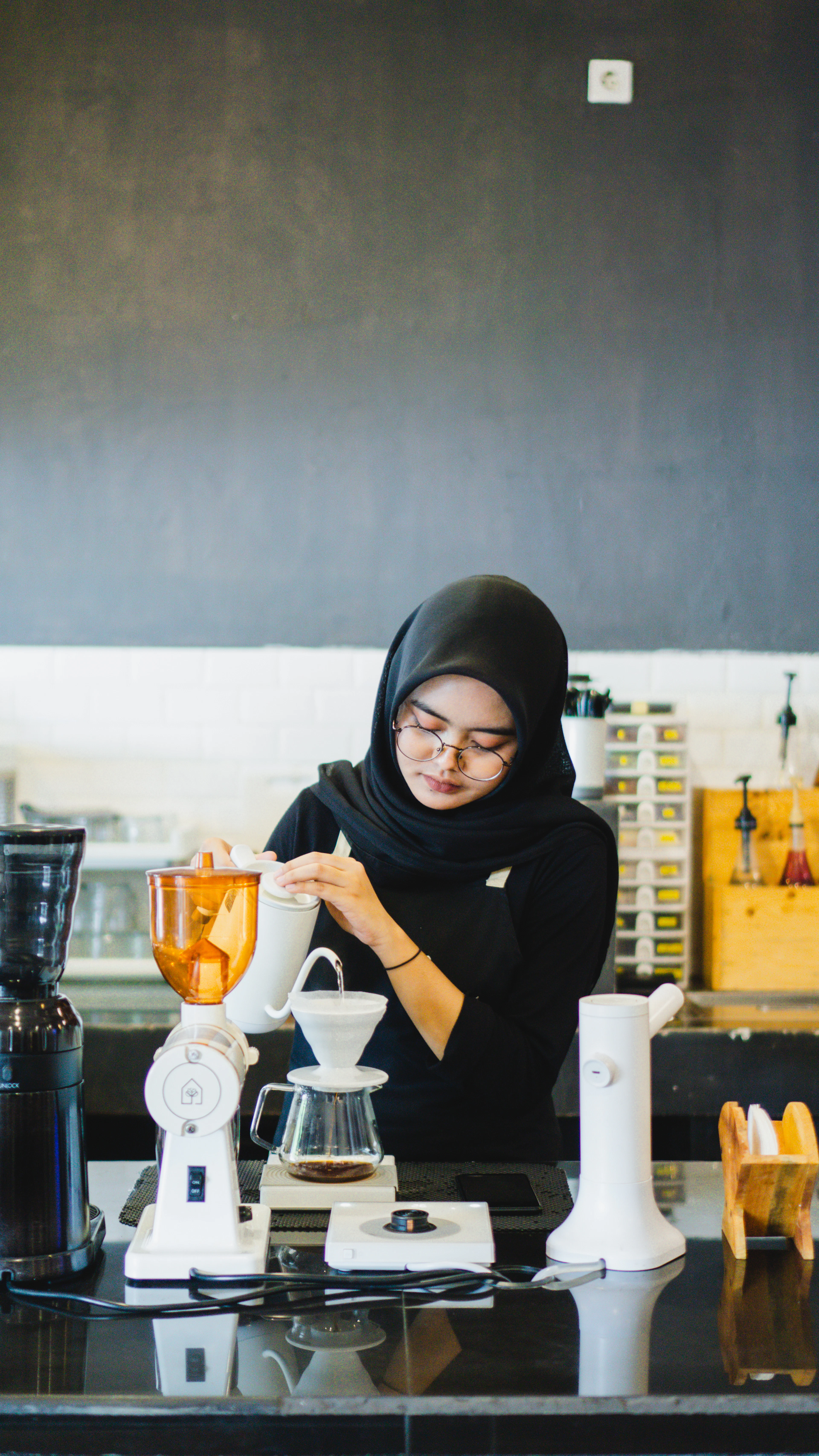 Amira Saleh brewing a pour-over