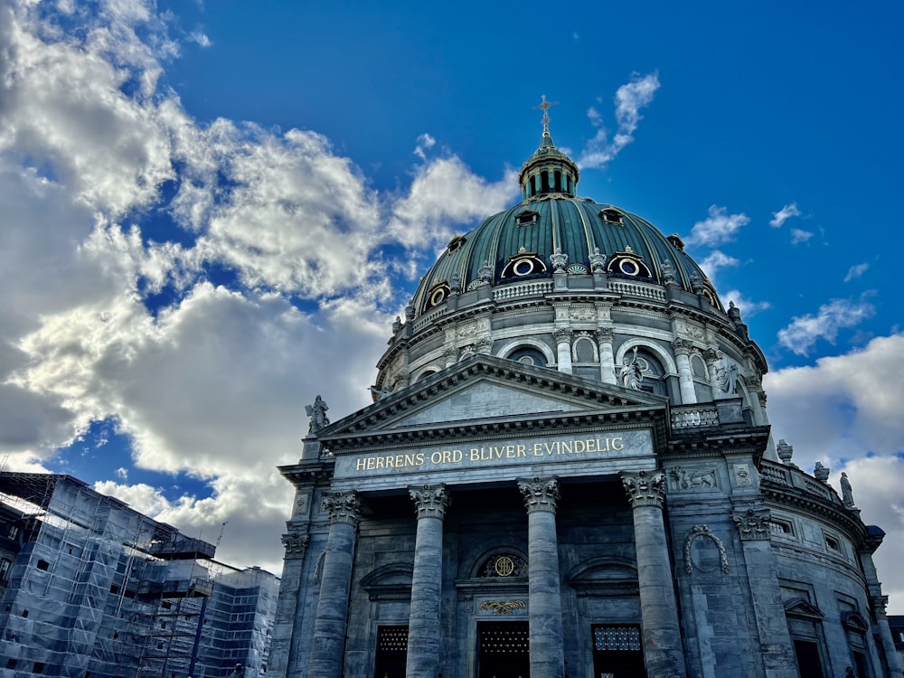 a large building with a dome and columns