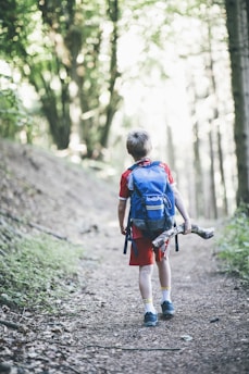 a boy walking on a path