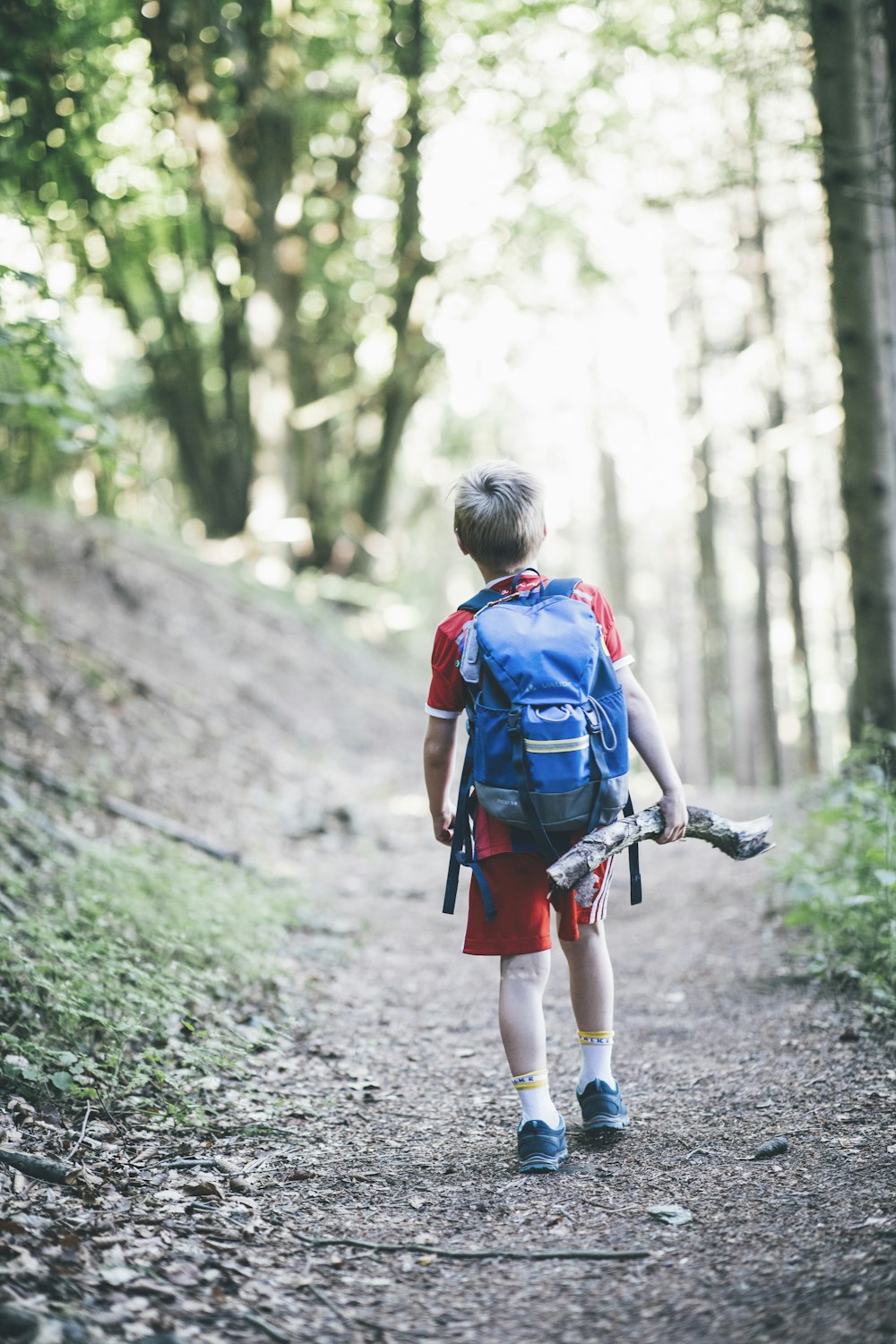 a boy walking on a path