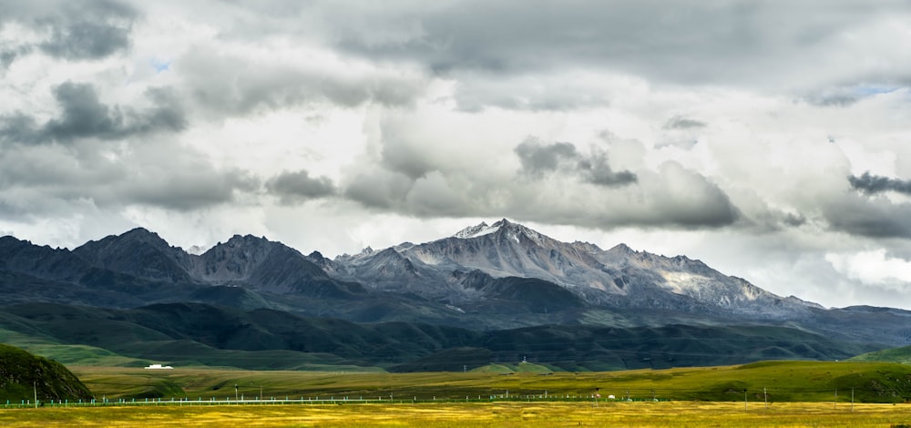 a mountain range with clouds