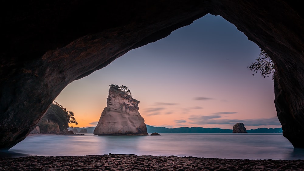 a large rock formation in the water