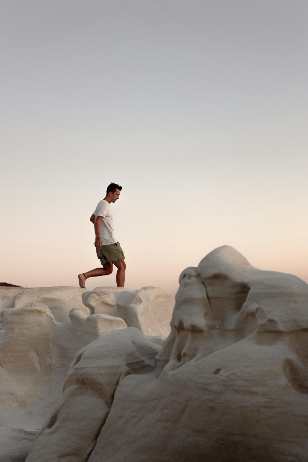 a man jumping off a cliff