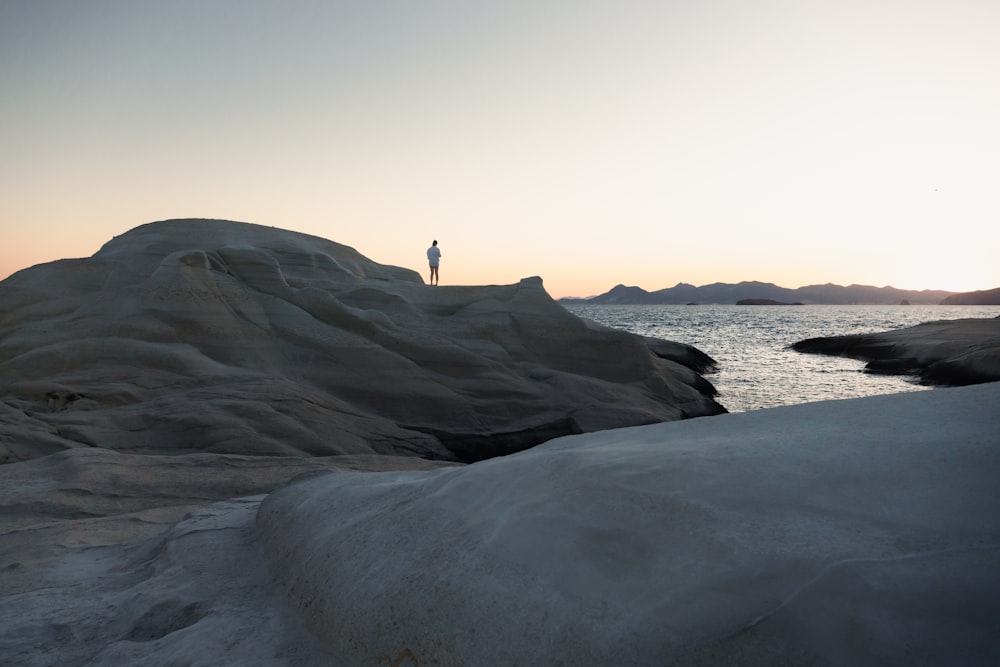 a person standing on a rock