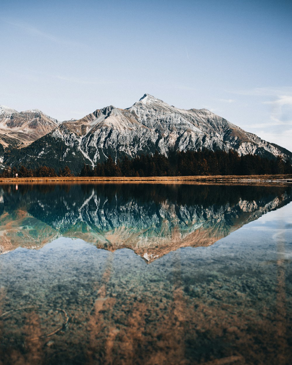 a lake with a mountain in the background