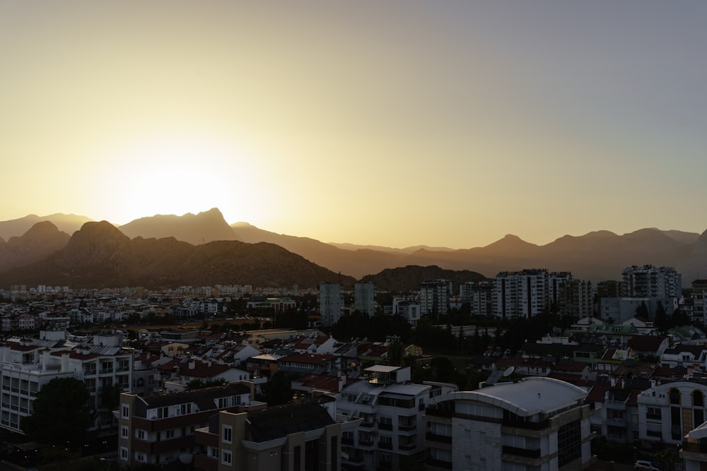 a city with mountains in the background