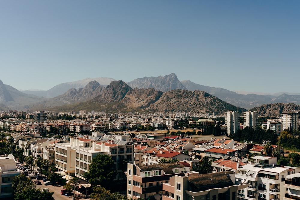 a city with mountains in the background