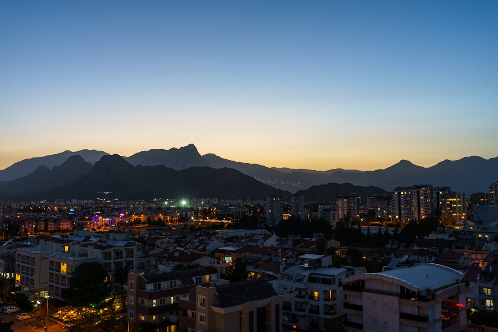 a city with mountains in the background