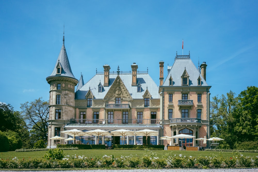 a large building with a garden in front of it