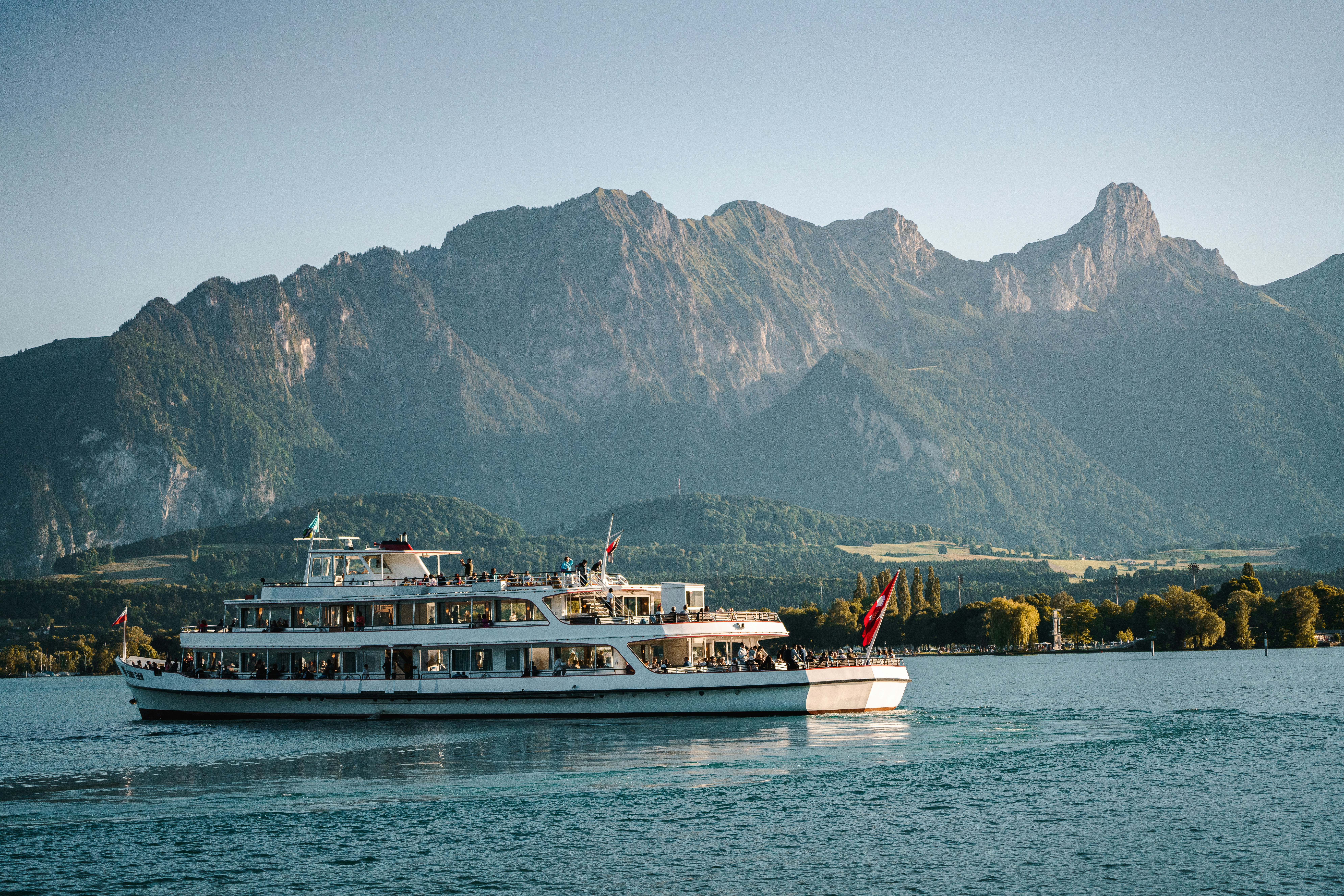 a boat on the water, Cruising on Lake Thun