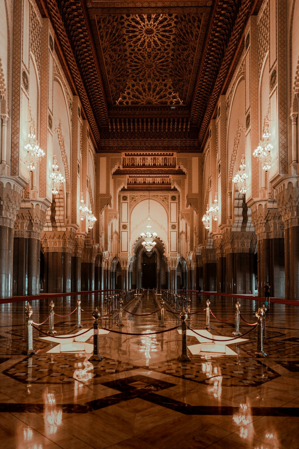 a large ornate room with candles