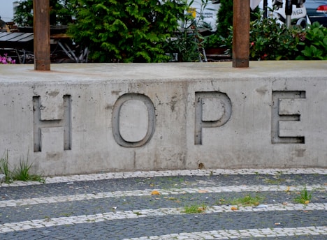 a concrete wall with a sign on it