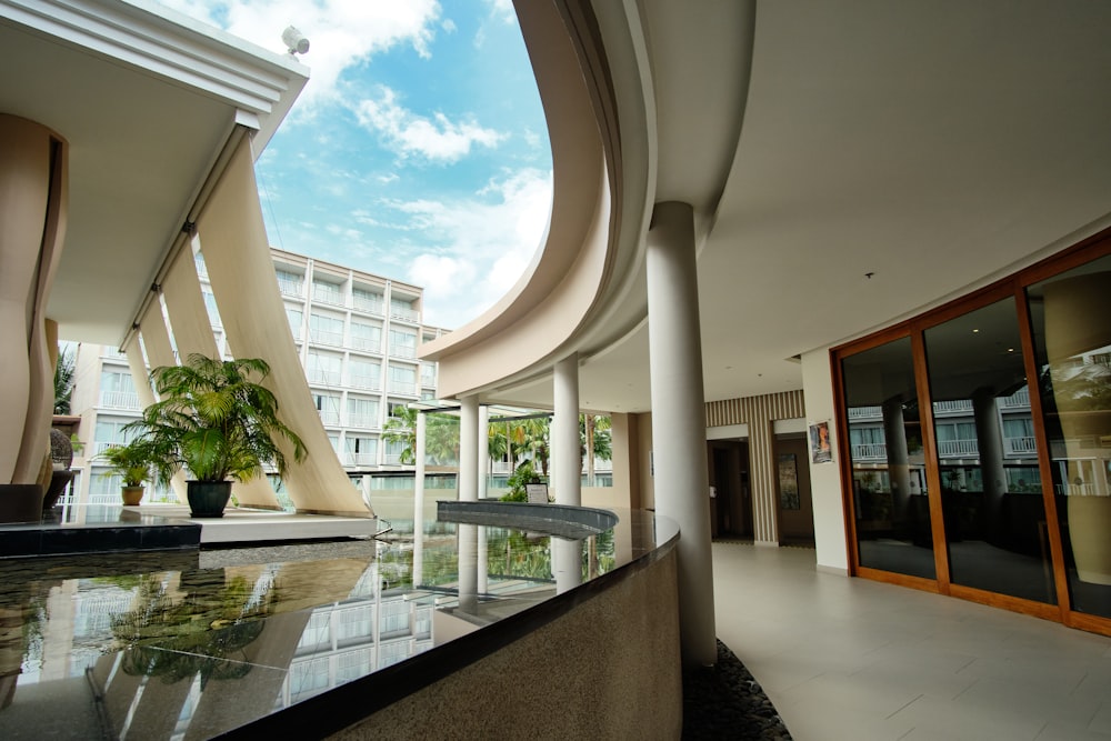 a building with a pool and a large glass front