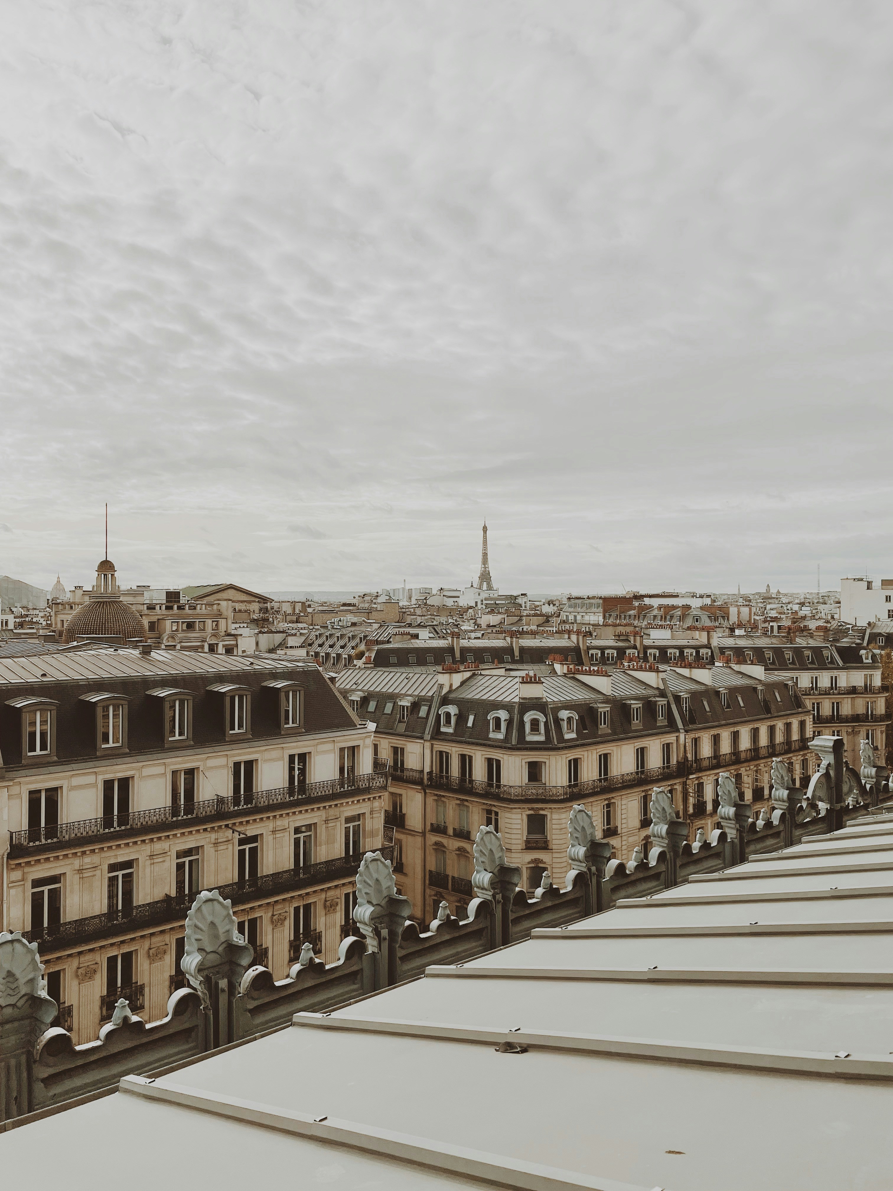 a group of people standing on a bridge over a body of water